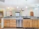 Kitchen with granite countertops, stainless steel appliances, and wood cabinets at 5085 Bone Ln, Brooksville, FL 34604