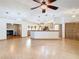 Open kitchen with island and wood cabinets at 5085 Bone Ln, Brooksville, FL 34604
