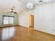 Spacious living room featuring hardwood floors and an arched hallway at 5085 Bone Ln, Brooksville, FL 34604