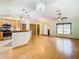 Hardwood floor living room with access to kitchen and pantry at 5085 Bone Ln, Brooksville, FL 34604