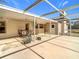 Covered patio with seating area and backyard access at 5085 Bone Ln, Brooksville, FL 34604