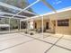 Relaxing screened patio with table and chairs at 5085 Bone Ln, Brooksville, FL 34604