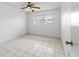 Bedroom with tiled floors and a ceiling fan at 5320 Buttonwood Dr # 5320, New Port Richey, FL 34652