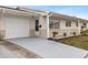 Front view of a single-story home with a garage and landscaped yard at 5320 Buttonwood Dr # 5320, New Port Richey, FL 34652