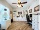 Bright home office features built-in shelving and cabinetry, hardwood floors, and ample workspace at 6151 Louisiana Ave, New Port Richey, FL 34653