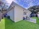 View of house exterior showcasing a well-maintained lawn at 6151 Louisiana Ave, New Port Richey, FL 34653