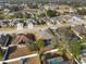 Aerial view of the home, neighborhood, and tree-lined streets in a tranquil setting at 692 Challice Dr, Spring Hill, FL 34609