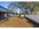 Expansive backyard featuring a vinyl fence for privacy and lush trees for shade at 692 Challice Dr, Spring Hill, FL 34609