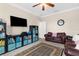 Bedroom with custom accents, ceiling fan, neutral color palette, and hardwood floors at 692 Challice Dr, Spring Hill, FL 34609