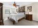 Beautiful, carpeted main bedroom features large windows and a neutral color palette at 692 Challice Dr, Spring Hill, FL 34609