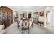 Open-concept dining room with decorative china cabinets and views into other living spaces at 692 Challice Dr, Spring Hill, FL 34609