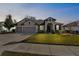 Charming single-Gathering home with a three-car garage, manicured lawn, and inviting entry at 692 Challice Dr, Spring Hill, FL 34609