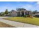 Charming single-story home featuring a three-car garage, neutral paint, and manicured landscaping at 692 Challice Dr, Spring Hill, FL 34609