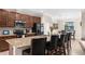 Stylish kitchen featuring a large island with seating and stainless steel appliances at 692 Challice Dr, Spring Hill, FL 34609