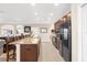 Bright kitchen features an island with a breakfast bar and modern appliances at 692 Challice Dr, Spring Hill, FL 34609