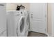 Convenient laundry room with a side-by-side washer and dryer at 692 Challice Dr, Spring Hill, FL 34609