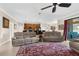 Open-concept living area showcases tile floors and access to outdoor living spaces at 692 Challice Dr, Spring Hill, FL 34609