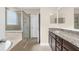 Main bathroom features a glass shower enclosure, tub, and vanity with granite countertop at 692 Challice Dr, Spring Hill, FL 34609
