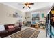 Well-lit playroom with hardwood floors, fan, and neutral color palette at 692 Challice Dr, Spring Hill, FL 34609