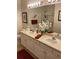 Double vanity bathroom with a large mirror and shower at 7221 Cleopatra Dr, Land O Lakes, FL 34637