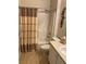 Clean bathroom with shower/tub combo and neutral decor at 7221 Cleopatra Dr, Land O Lakes, FL 34637