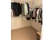 Walk-in closet with ample hanging and shelving space at 7221 Cleopatra Dr, Land O Lakes, FL 34637