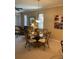 Bright dining room featuring a glass-top table and four chairs at 7221 Cleopatra Dr, Land O Lakes, FL 34637