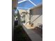 Screened entryway with a bench and small garden at 7221 Cleopatra Dr, Land O Lakes, FL 34637