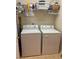 Laundry room with washer, dryer, and shelving at 7221 Cleopatra Dr, Land O Lakes, FL 34637