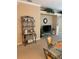 Open living room with a TV stand and decorative shelving at 7221 Cleopatra Dr, Land O Lakes, FL 34637