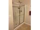 Clean shower with sliding glass doors and tiled walls at 7221 Cleopatra Dr, Land O Lakes, FL 34637