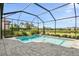 Screened pool and patio area with water feature at 8287 Velda Trl, Sarasota, FL 34241