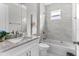 Clean bathroom with granite countertop and a bathtub at 8290 40Th N St, Pinellas Park, FL 33781