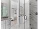 Elegant bathroom with a glass shower, double vanity, and bedroom view at 8290 40Th N St, Pinellas Park, FL 33781
