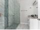 Modern bathroom with a large glass shower and white cabinets at 8290 40Th N St, Pinellas Park, FL 33781