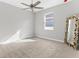 Spacious bedroom with neutral carpeting and ceiling fan at 8290 40Th N St, Pinellas Park, FL 33781