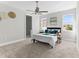 Spacious bedroom with carpeted floor, ceiling fan and ensuite bathroom at 8290 40Th N St, Pinellas Park, FL 33781