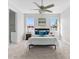 Bright bedroom featuring carpeted floors and a ceiling fan at 8290 40Th N St, Pinellas Park, FL 33781