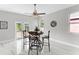 Casual dining area with a table and four chairs near sliding doors at 8290 40Th N St, Pinellas Park, FL 33781