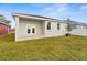 Newly built home with covered patio and grassy backyard at 8290 40Th N St, Pinellas Park, FL 33781