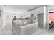 Modern kitchen with white cabinets and granite countertops at 8290 40Th N St, Pinellas Park, FL 33781