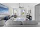 Open living area with gray sofas, ceiling fan, and marble floors at 8290 40Th N St, Pinellas Park, FL 33781
