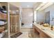 Bathroom with double vanity and walk-in shower at 8540 Caitlin Ct, Hudson, FL 34667
