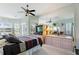 Primary bedroom with mirrored walls and large dresser at 8540 Caitlin Ct, Hudson, FL 34667