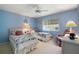 Spacious bedroom with twin beds, ceiling fan, and calming decor at 8540 Caitlin Ct, Hudson, FL 34667