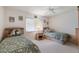 Bright bedroom with twin beds, ceiling fan, and ample closet space at 8540 Caitlin Ct, Hudson, FL 34667