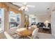 Bright breakfast nook with a wood table and chairs, overlooking the living room at 8540 Caitlin Ct, Hudson, FL 34667