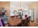 Elegant dining room featuring a wood table, chandelier, and built-in hutch at 8540 Caitlin Ct, Hudson, FL 34667