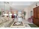 Bright and spacious entryway with tile flooring and views into the living and dining rooms at 8540 Caitlin Ct, Hudson, FL 34667