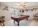 Spacious game room featuring a pool table and seating at 8540 Caitlin Ct, Hudson, FL 34667